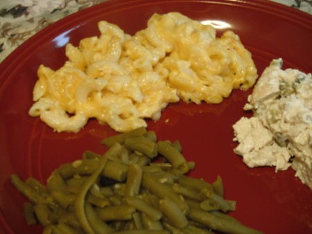 Macaroni and Cheese, salad & beans on plate