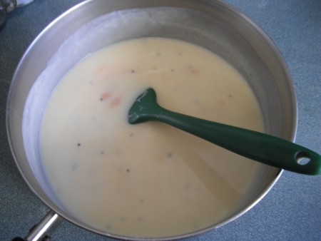 mixing Cheese into milk