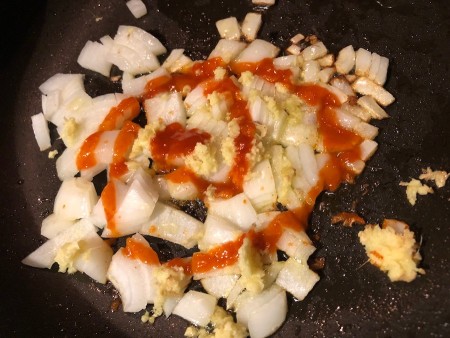 ginger, onions, garlic & chili sauce in pan