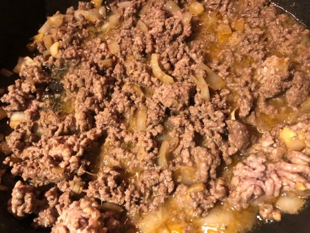 ground beef added to ginger & garlic & ginger in pan