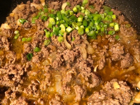 green onions added to beef