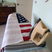 Adhering Heat and Bond to stiffen an American flag.