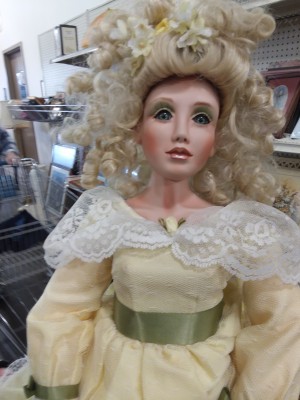 Identifying a Porcelain Doll - closeup of doll with mass of platinum curls and lace collared dress