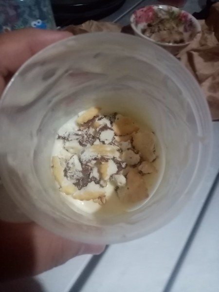 cookies in container on mixed cream