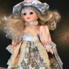 Value of a Cathay Collection Doll  - doll wearing a peach and gray and white floral dress