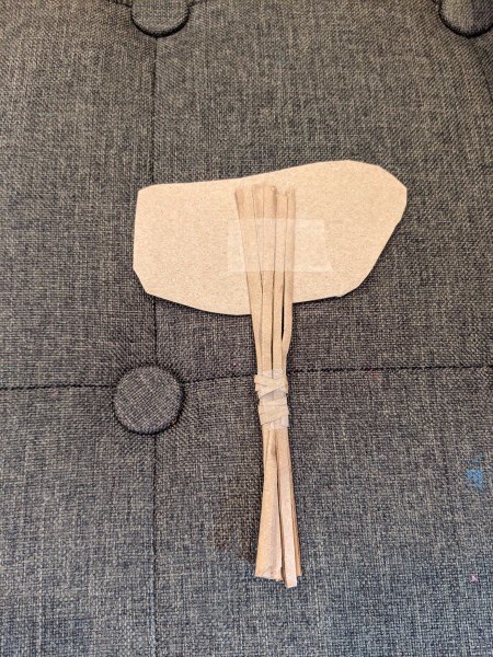 Making Animal Plant Pal Stakes - tape holds the image to the stake