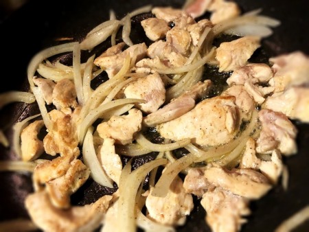 cooking Chicken & onions in pan