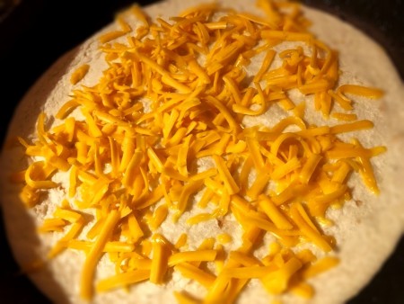 add cheese to tortilla