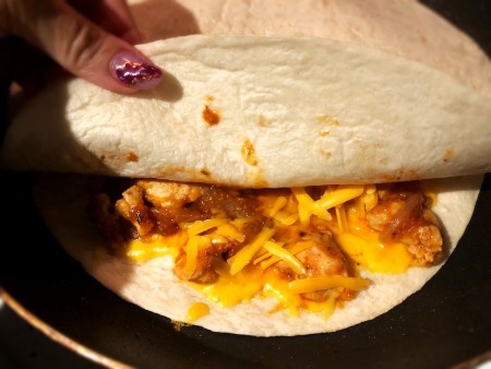 add tortilla to top of filling