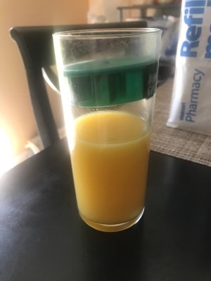 Lid Stuck in Glass - green orange juice jug lid stuck in tall glass