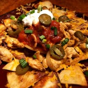 Loaded Chicken Nachos on plate