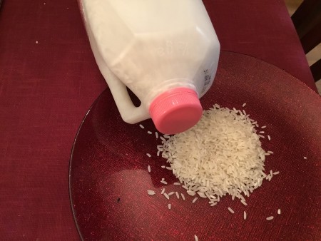 A milk jug used for storing rice.