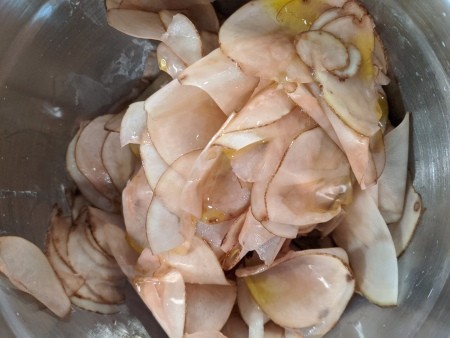 sliced Potatoes tossed with oil