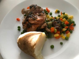 Sauteed Chicken Thighs with veggies on plate