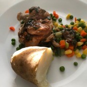 Sauteed Chicken Thighs with veggies on plate