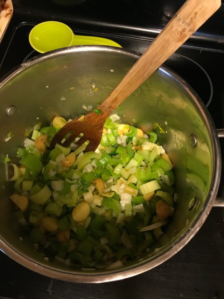 The vegetables being cooked in a soup pot.