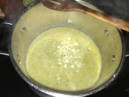 The creamy soup placed back in the pot to warm.