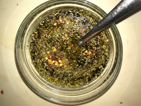 A bowl of vinaigrette ingredients.