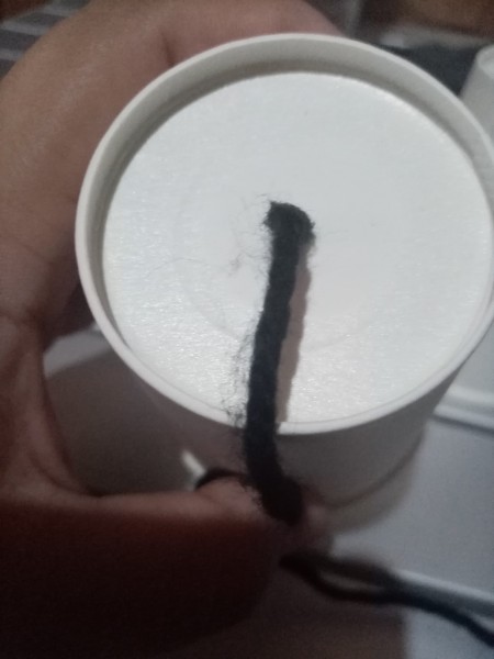 Paper Cup and String Telephone - string pushed through the hole from the bottom