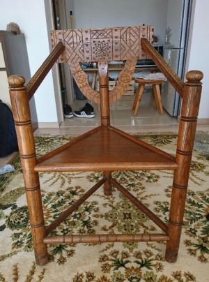 Identifying a Three Legged Turned Chair  - three legged chair with triangle seat, turned legs, and a design carved into the back rest