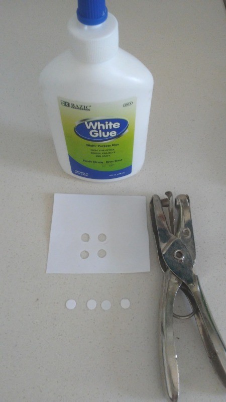 Alligator Clothespins - bottle of white glue, punch, piece of white paper and 4 punches