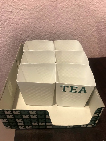 DIY Hot Cup Sleeve Tea Organizer - restructured sleeves in the cardboard box with one marked TEA with stickers