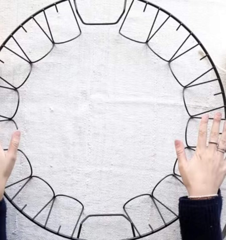 Identifying a Flea Market Item- wire circle with multiple wire rectangles set at an angle so that they slant to the center