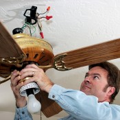 Man Repairing a Ceiling Fan