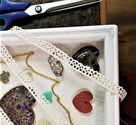 Protecting and Displaying Your Collection - lace lying across the shadow box
