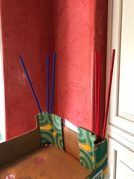 DIY Foosball Game Shoebox - three red and three blue dowels drying