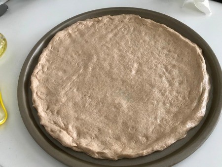 Pizza Dough spread in pan