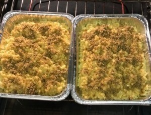 Macaroni and cheese in foil containers.