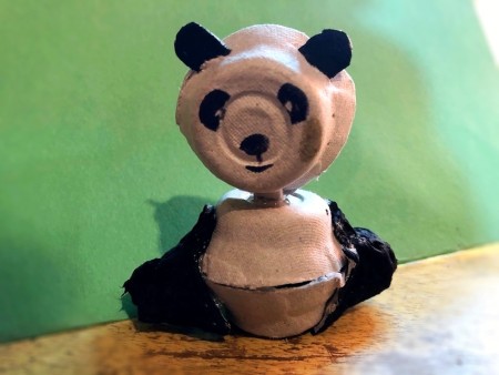 Egg Carton Panda - glue on the legs and arms pieces