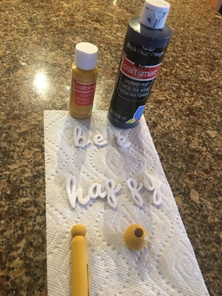 Bee Happy Garden Sign - letters and clothespin and bead for making the bee, two bottles of paint