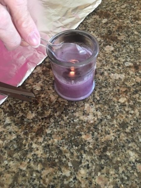 Bee Happy Garden Sign - melting plastic spoon over candle