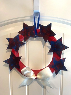 Recycled Paper Memorial Day Wreath - finished wreath hanging on over the door hook