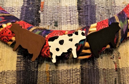 Spring Calving Season Cowboy/Cowgirl Wreath - closeup of the three cows on the bottom area of the wreath