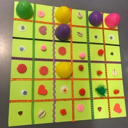 Plastic Egg Match-Up Game - some items uncovered and others still covered with an egg half