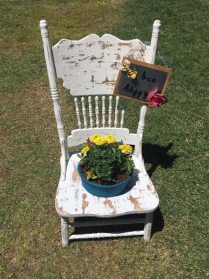 Garden Flowerpot Chair Planter - finished planter with yellow flowers and the bee garden sign