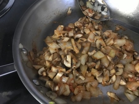 Mushrooms & onions in pan