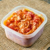 A container of frozen tomato sauce.