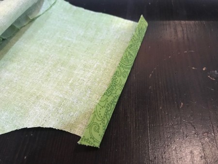 Non-Pleated Face Mask - fold in 1/4" on the straight side of the liner, fold in again and press, repeat on other end