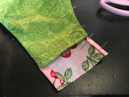 Non-Pleated Face Mask - pins in main end tab and across the top of the mask, topstitch