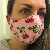 Non-Pleated Face Mask - women's over the ear mask made with pink fabric with cherry motif
