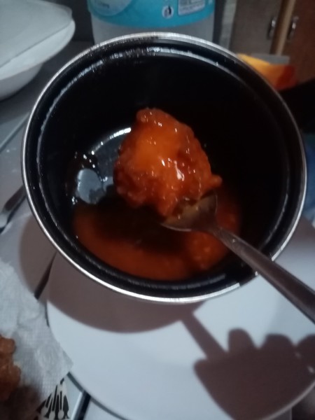 balls dipped in caramel sauce