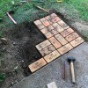 Adding bricks to the patio.