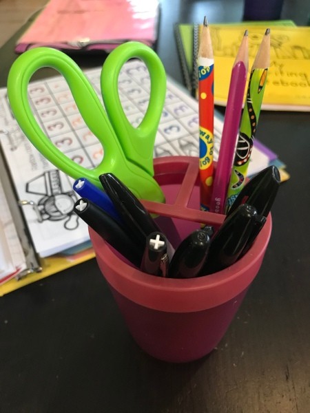 Toothbrush Holder for Desk Supplies - closeup of desk supplies in a red toothbrush holder