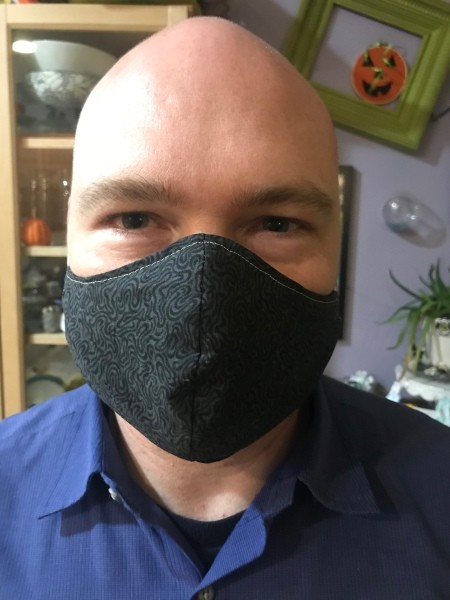 Non-Pleated Face Mask - adult man's mask on model
