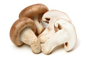 A collection of sliced and whole mushrooms.