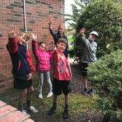 A family waving at their grandma.